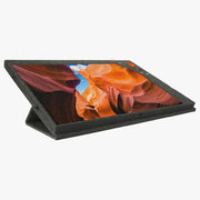 Plateau de puzzle en feutre anthracite pour 1 500 pièces en position inclinée, avec un puzzle de canyon orange